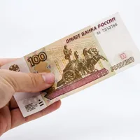closeup-shot-of-a-person-holding-some-cash-over-a-white-isolated-scaled.jpg
